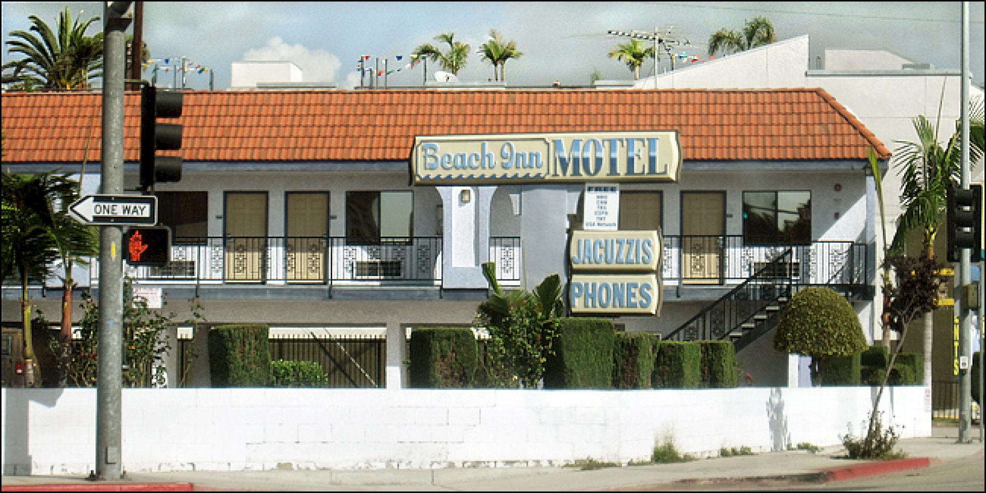 A two-story motel with a sign reading 